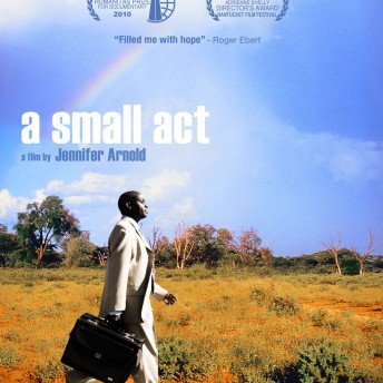 Poster of A Small Act. A man in a white suit is walking with a briefcase in front of an open land with dry grass and a bright blue sky and a rainbow. The graphics on it say the name of the film and the name of the director: Jennifer Arnold.
