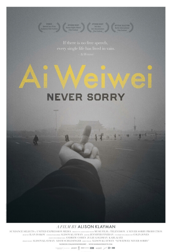 Poster of Ai Weiwei: Never Sorry. Photo of Ai Wei Wei's middle finger at a building. On the poster, there is yellow typography with the film's title.