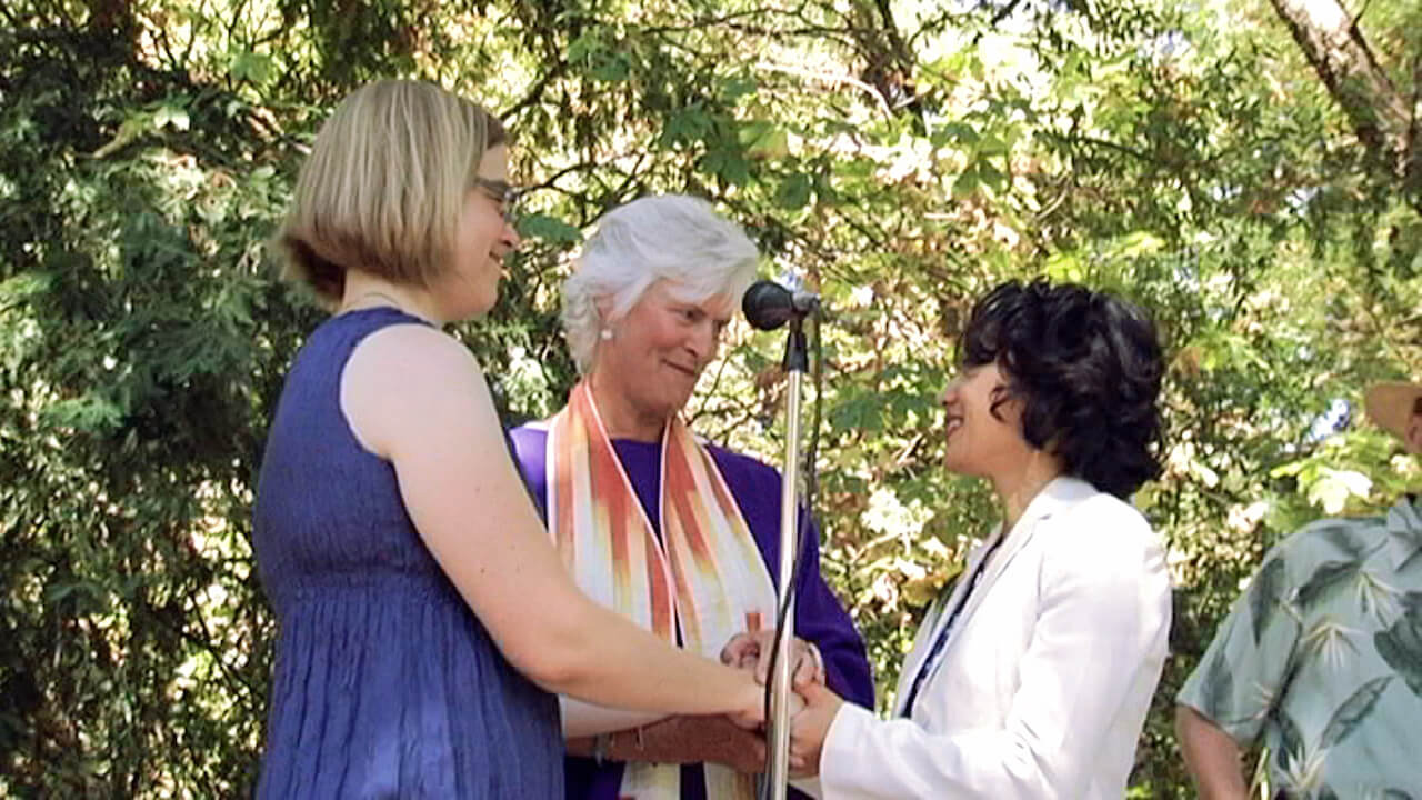 A still from The Campaign. Two women in their marriage ceremony.
