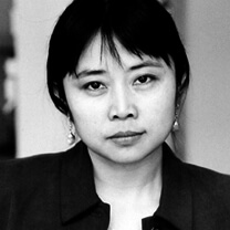 Weimin Zhang looks at the camera. Black and white portrait.