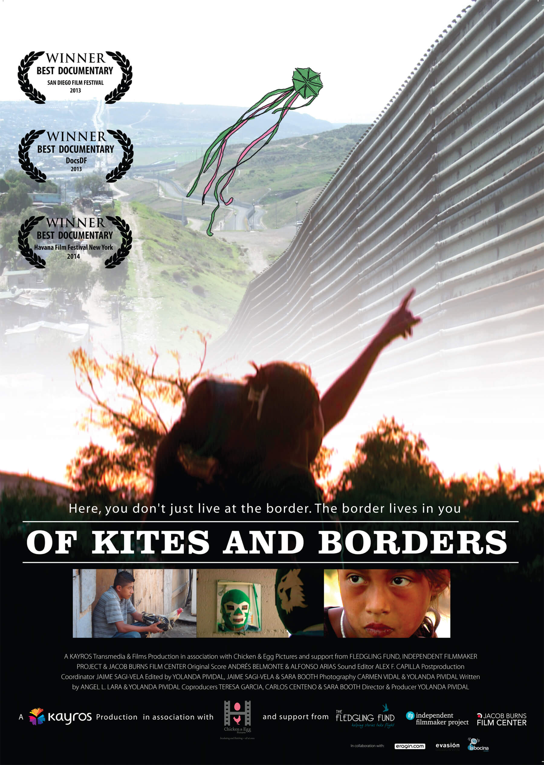 Poster of Of Kites and Borders. Above the title of the film is a women pointing up at a large fence, with a kite floating above the fence. Below the title of the film are three images, (left:) young man holding a chicken, (center:) someone looking in a mirror with a green lucha libre mask on, and (right:) close-up of a young child's face. Below the three images are the credits for the film.