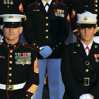 Still from The Invisible War. A close-up shot of a group of US Marines, standing shoulder to should, in uniform.