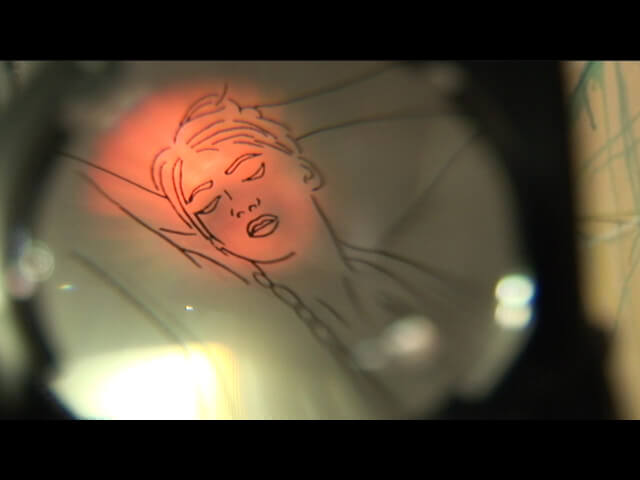 Still from Our City Dreams. A simple line drawing of a woman with her hands behind her head is shown through a lense.