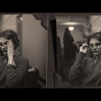 Still from Our City Dreams. Two vintage, sepia toned, images sit side by side of a woman with glasses and a cigarette.
