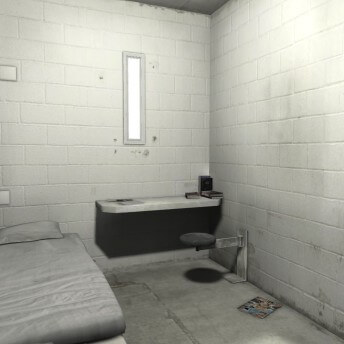 Still from An Immersive Experience of Solitary Confinement Impact & Innovation Initiative. Shot of a prison cell: a bed with a bench, a shelf with some books, and a small rectangle window.