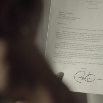 Over shoulder shot of a person reading a signed document.