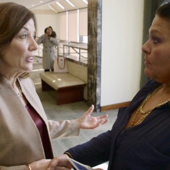 Kim Dadou Brown shakes hands and talks about New York’s Domestic Violence Justice Act with Lieutenant Governor of New York Kathy Hochul at the Women’s Justice Agenda