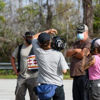 Jesse and Sasha documenting two participants in a walk through the Big Cypress.