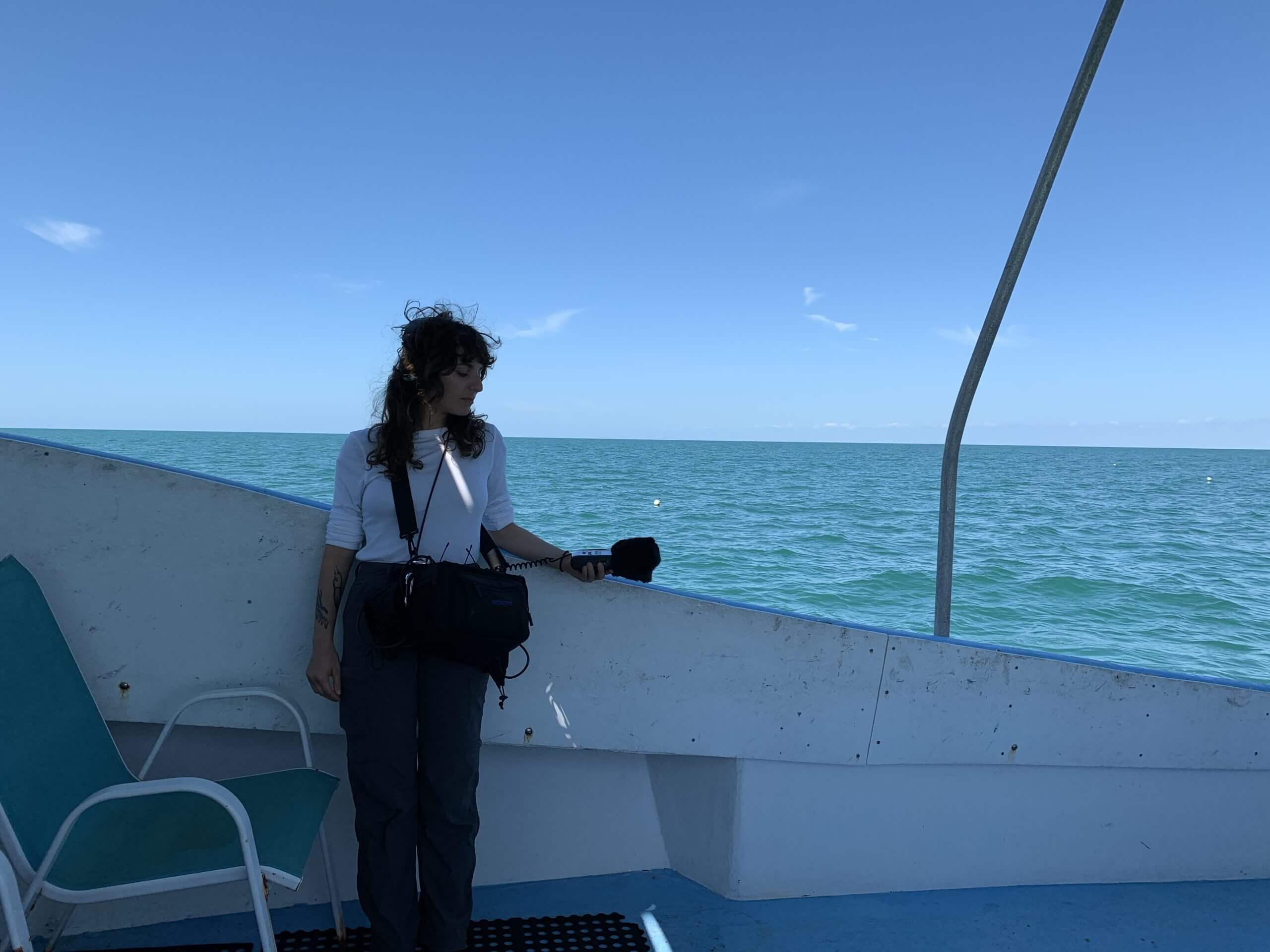Sasha records sounds on a boat in the Gulf of Mexico