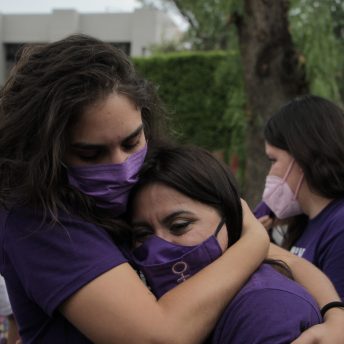 Director Indira Cato and Olimpia Coral hugging each other after the Olimpia Law's approval at the Mexico City Chamber of Deputies in 2021.