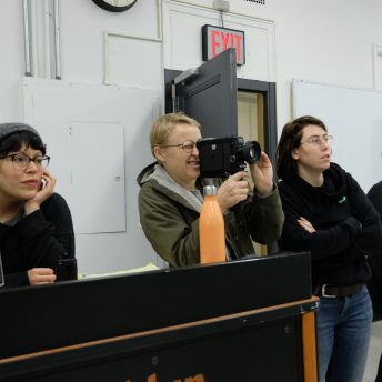 Four production team members of Takeover, with director Emma Francis-Snyder, one of them holds a camera