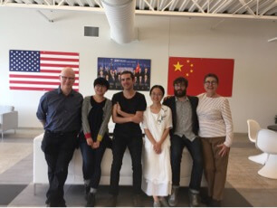(Left to Right) Steven Bognar, Yiquian Zhang, Erick Stoll, Mijie Li, Jeff Reichert, and Juli Reichert pose for a photo and Fuyao Glass USA in Dayton, Ohio.
