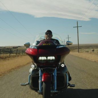 Man on motorcycle riding through Texas.
