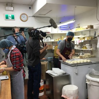Crew filming William Liu in the kitchen of Kam Wai Dim Sum in Vancouver's Chinatown