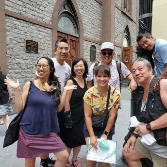Director Karen Cho posing with Film Subject Jan Lee and other Chinatown organizers at a block party in New York's Chinatown.