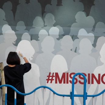 An artist relentlessly sprays public walls with life-size shadows of girls tagged #missing