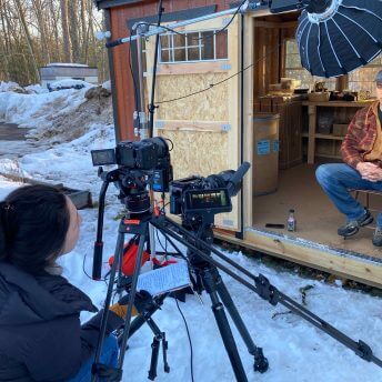 Director Tsanavi Spoonhunter conducting a sitdown interview with Ojibwe spearfisher, Greg Johnson, outside of his home during the winter.