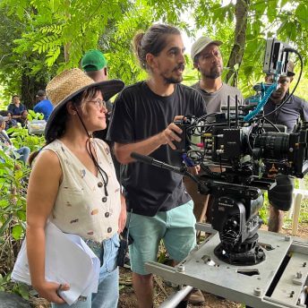 The Director and DP of Matininó prepare the camera for the scene.