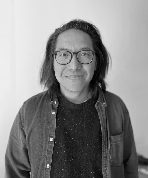 Headshot of Stephen Maing in black and white